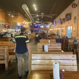 a man walking through a restaurant