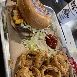 Branded Cheeseburger with American cheese and onion rings