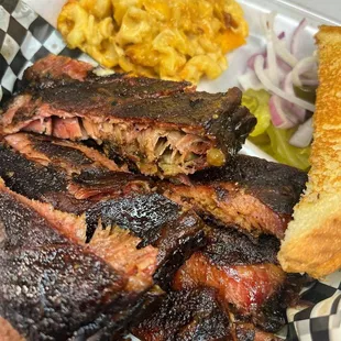 Tender and Perfectly cooked Ribs. Mac n Cheese and Potato Salad are great too.