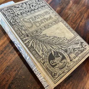 an old book on a wooden table
