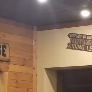 Outhouse and more dining area signs