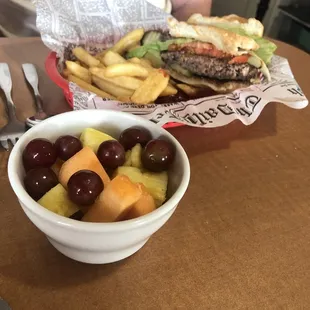 Hamburger, fries, fresh fruit