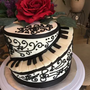 a cake with a rose on top