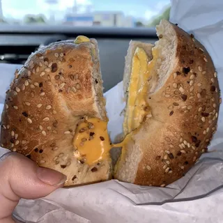 Buttered Bagel With Egg And Cheese