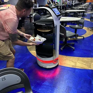 They got an adorable robot that brings your food to your lane!!!