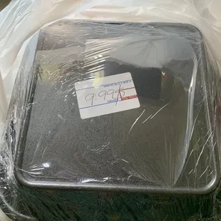 a piece of luggage wrapped in plastic