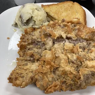 Chicken fried steak with gravy on the side.homemade and very yummy