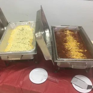 three pans of food on a table