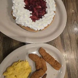 Chicken and waffles. Upgraded Belgin waffle with strawberries, sweet cream cheese and whipped cream