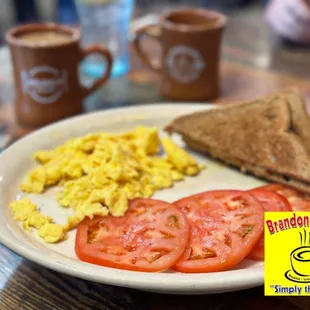 Two 2 Eggs Plate - tomato slices and wheat toast. Had really good coffee and attentive server. Great brunch all the way around.