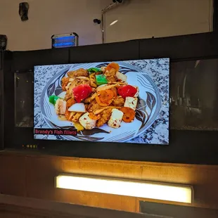 TV monitor showing food photos