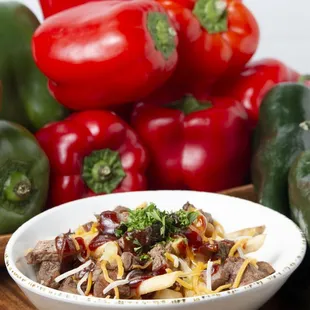 a bowl of beef and peppers