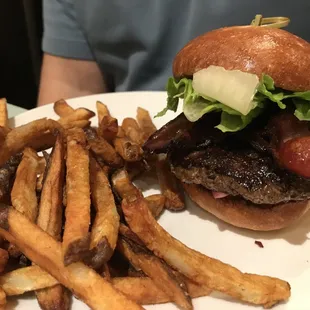 a hamburger and fries on a plate