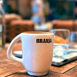 a coffee cup on a wooden table