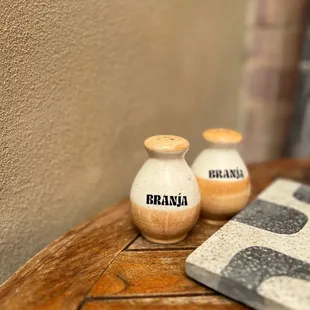 two salt and pepper shakers on a table