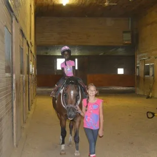 One or students helping another student - (Brannon Stables - Lexington Horse Riding Lessons, Lexington Horse Boarding)