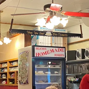Note the sign on the saw above the cooler full of desserts.