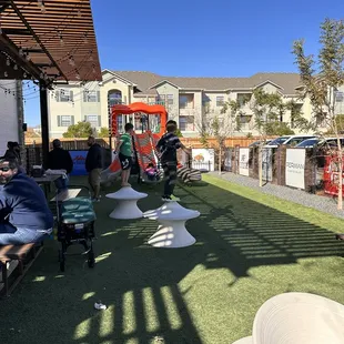 people sitting at tables outside