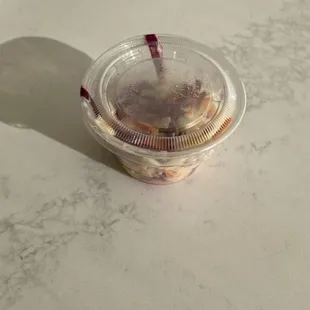This tiny, unfilled container of coleslaw (barely enough for a garnish) cost $2