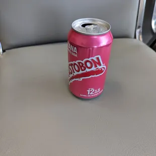 a can of soda on a seat