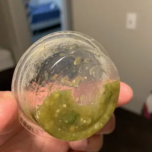 Empty container with just a lil of sauce, not good enough for a whole chicken