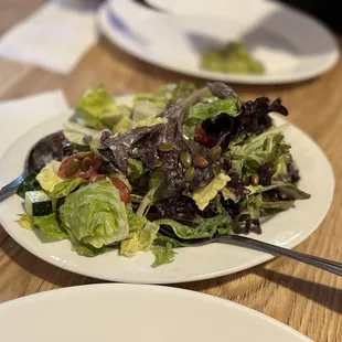 a salad on a plate with a fork