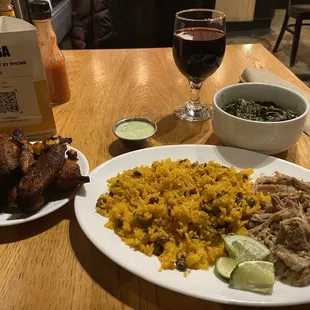 Slow Roasted Pork, Rice and Peas with Sofrito &amp; Ham, Plantains, Collard Greens with Smoked Chicken, and Malbec Wine by the Glass