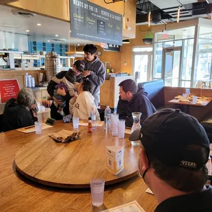 A table  We were seated at...  seated 8 adults and 2 children 1 toddler with a booster seat and one baby with a  High chair