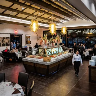 The main floor of our restaurant in Las Colinas is a spacious and elegant dining area that is sure to impress.