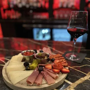 CHARCUTERIE BOARD indulge in a selection of the finest imported cheeses paired with a variety of cured meats