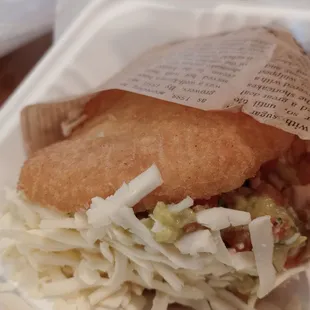 a sandwich in a styrofoam container