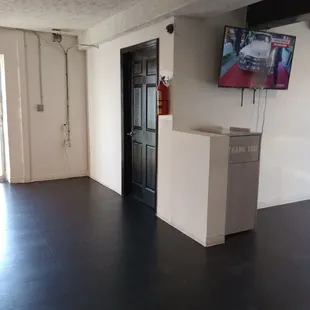 a kitchen with a television on the wall