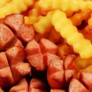 a close up of a hot dog and french fries