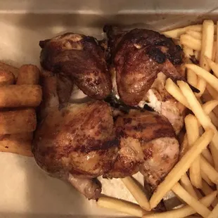 Whole Rotisserie Chicken with 2 sides (French fries and yuca fries).