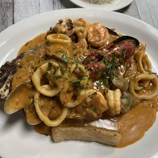 a plate of seafood and pasta