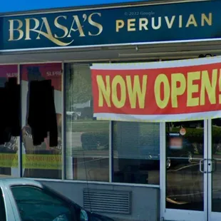 a car parked in front of the restaurant