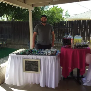 Drinks table with chalk board and skirt. A+ on the concept.