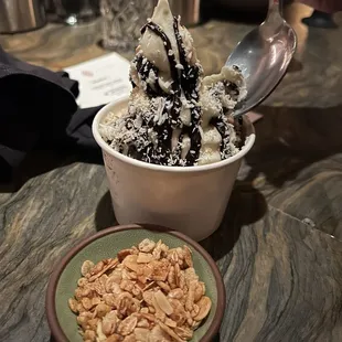 Coconut ice cream with fudge and a requested side of toasted almond granola