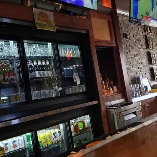 a bar with a large television