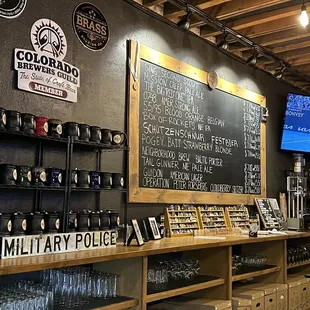 a bar with a chalkboard menu