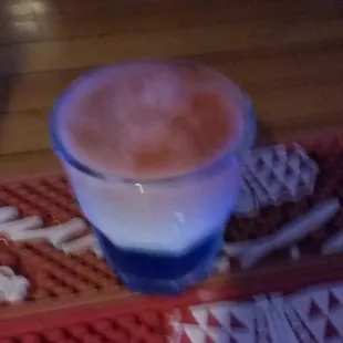a cup of coffee and golf tees
