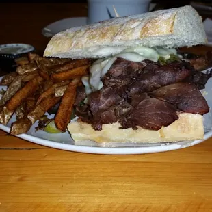 a steak sandwich and fries
