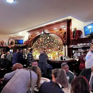 a large group of people sitting at tables