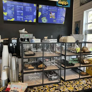 Counter area with danishes and the menu above.