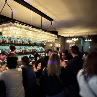 a crowd of people at a bar