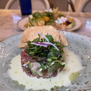 Yellowfin Tuna Tartare and Little Gem Salad in the back