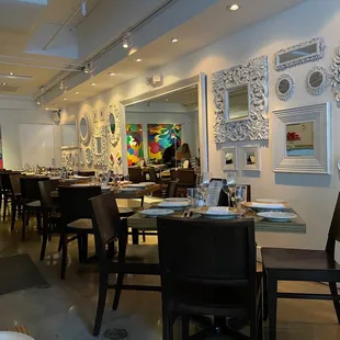a dining room with tables and chairs