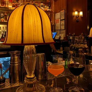 a bar with wine glasses
