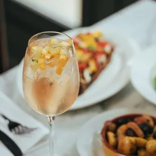 a glass of wine and a plate of food