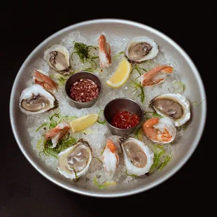 a platter of oysters and shrimp